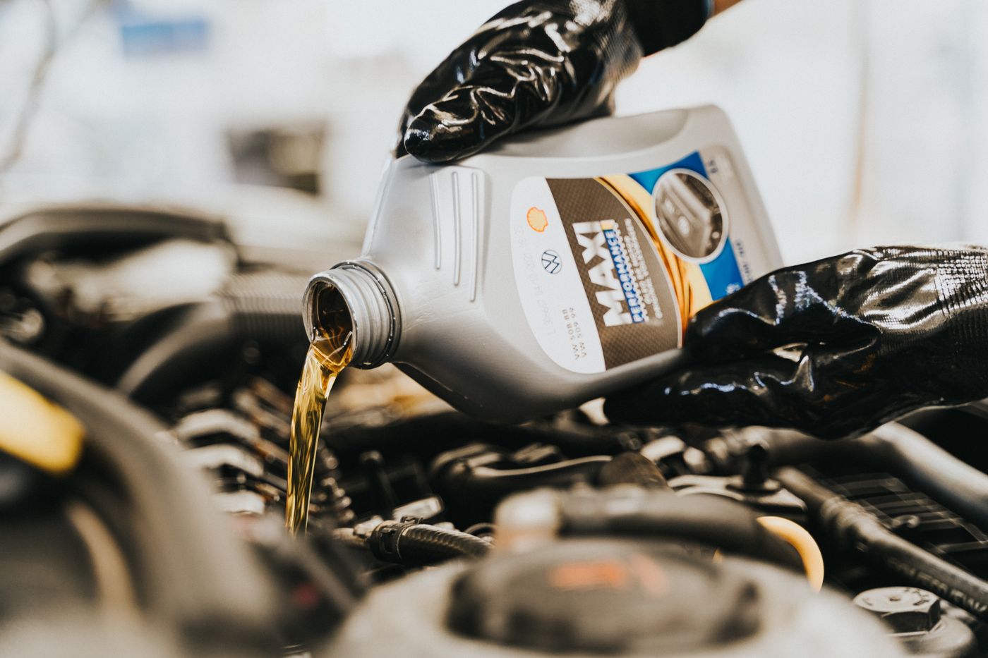 Fresh oil being poured during an oil change